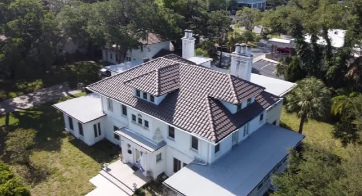 Dark tile roof on a historic white home