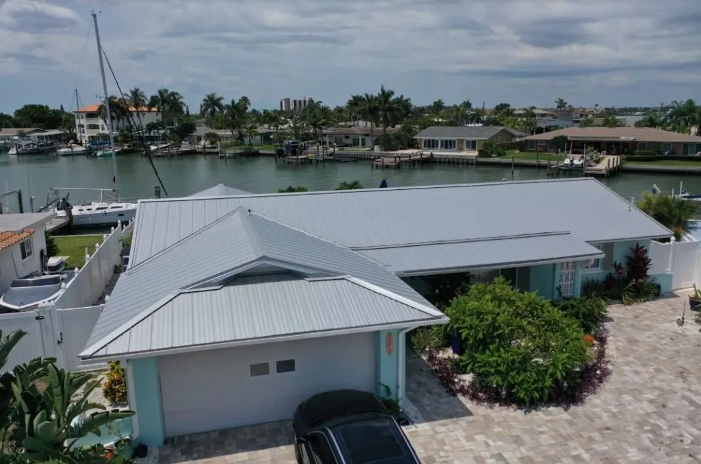 Silver metal roof on a canal-front home